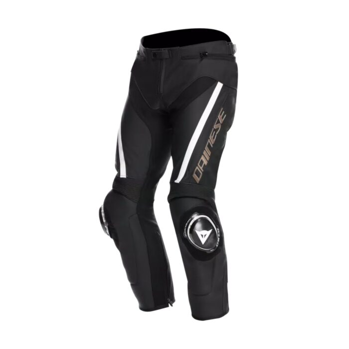 The Delta 4 motorcycle pants are crafted from durable Tutu cowhide leather and feature inserts of flexible S1 stretch fabric, matching perfectly with the Racing 4 and Avro 5 jackets. These pants can easily connect to the jackets via a convenient zipper, offering seamless integration for riders who prefer a coordinated look and enhanced functionality. Designed specifically for riders who enjoy sporty road riding, the Delta 4 Leather Pants offer exceptional comfort, versatility, and technical innovation inspired by MotoGP™ professionals. One standout feature is the new knee sliders, which are lighter in construction compared to previous models. Thanks to the Replaceable Slider System (RSS), these sliders can be swapped out and adjusted without moving the Velcro fastenings, allowing riders to customize their gear according to their personal style and preferences. Safety is a top priority with the Delta 4 pants, which include certified composite knee protectors and soft Pro-Shape 2.0 hip protectors. These components provide excellent shock absorption and impact protection in case of falls, ensuring the rider is well protected without sacrificing comfort or mobility. Ideal for mid-season riding, the pants incorporate breathable mesh fabric to enhance ventilation and help regulate temperature during warmer rides. Additionally, the Velcro fastener at the hem allows the pants to be easily worn with Dainese boots featuring the “IN” construction system. This ensures optimal ergonomics and riding comfort by securely fitting the pants over the boots. Overall, the Delta 4 pants combine premium materials, advanced protection, and thoughtful design, making them an excellent choice for riders who demand high performance and style on sporty road adventures.
